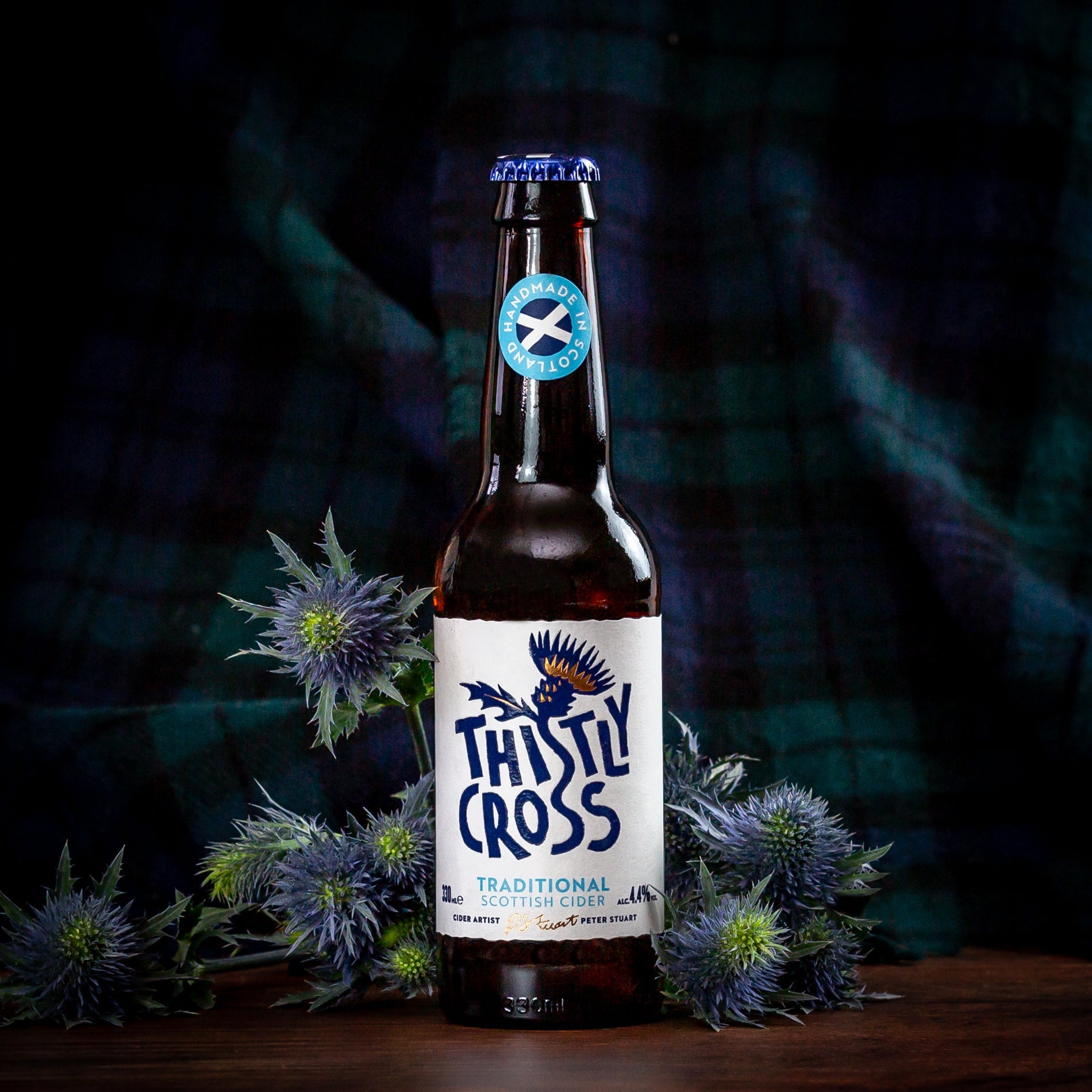 A bottle of thistly cross traditional cider with thistles